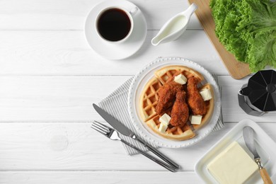 Photo of Delicious Belgium waffles served with fried chicken and butter on white table, flat lay. Space for text