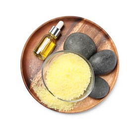 Photo of Yellow sea salt in bowl, spa stones and cosmetic product isolated on white, top view