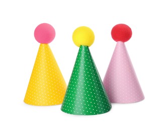 Photo of Colorful party hats on white background. Handmade decorations