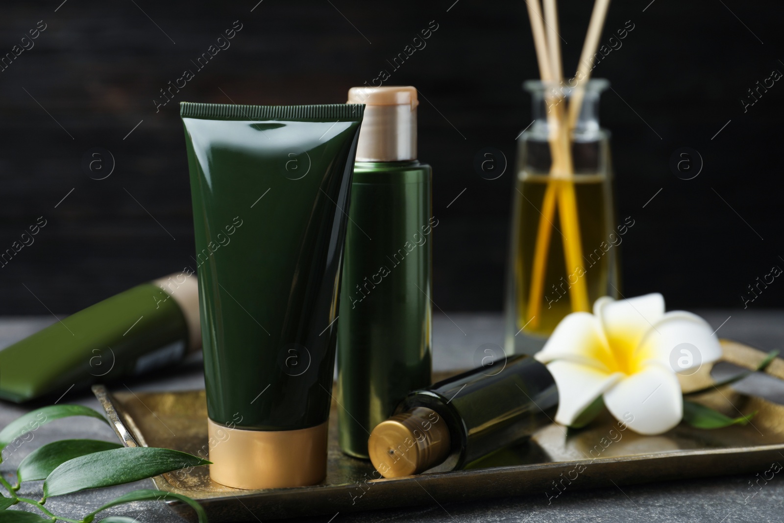 Photo of Composition with cosmetic products on grey table