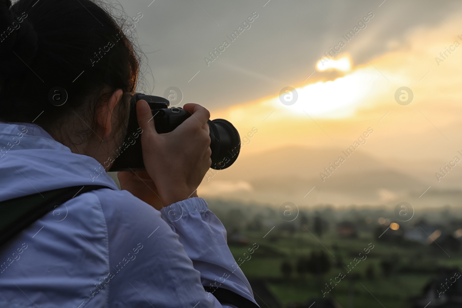 Photo of Professional nature photographer taking photos in mountains