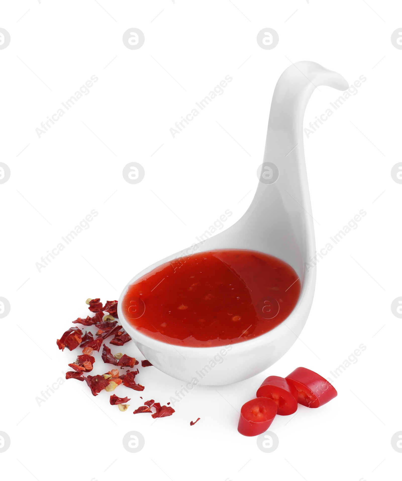 Photo of Chili sauce in spoon isolated on white