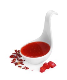 Photo of Chili sauce in spoon isolated on white