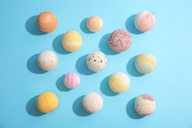 Photo of Flat lay composition with bath bombs on color background