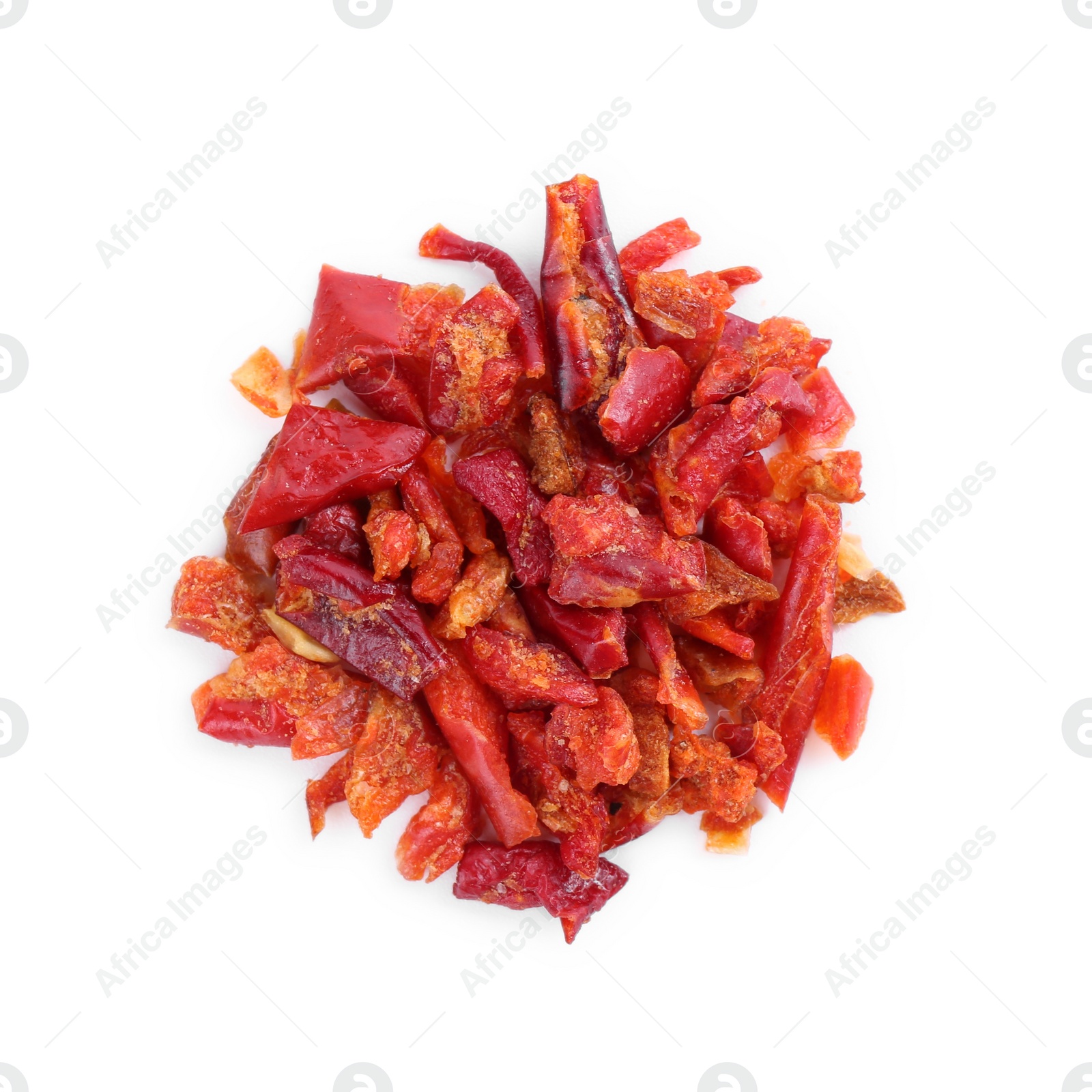 Photo of Aromatic spice. Red chili pepper flakes isolated on white, top view