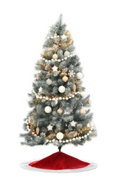 Photo of Decorated Christmas tree with red skirt on white background