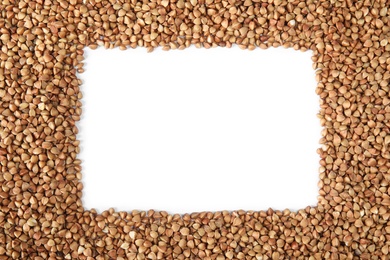 Frame made of uncooked buckwheat on white background, top view