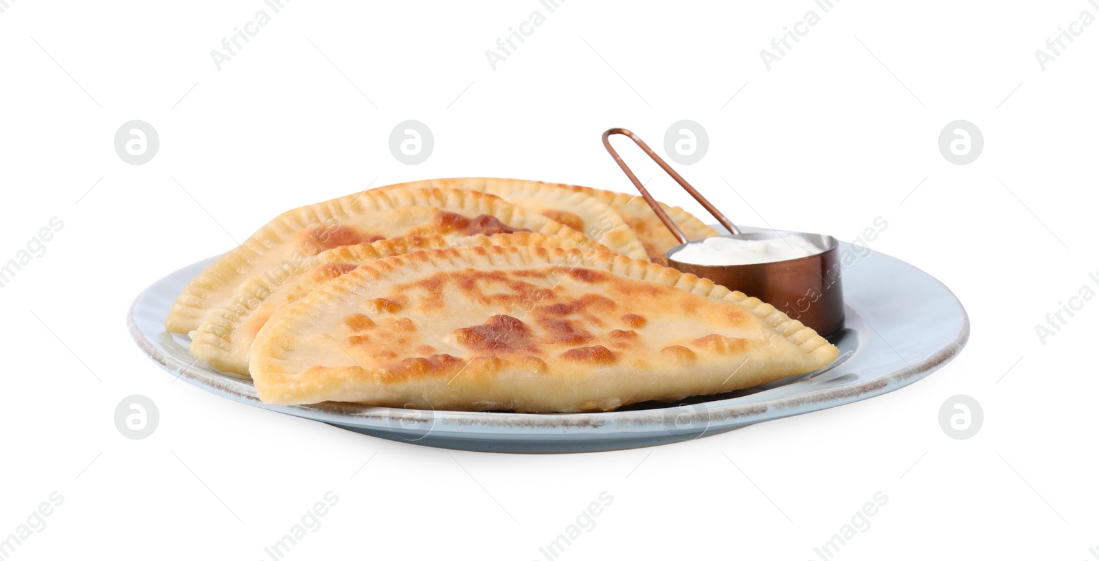 Photo of Delicious fried chebureki with cheese and sauce isolated on white