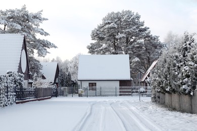 Photo of Winter landscape with modern houses and trees in morning