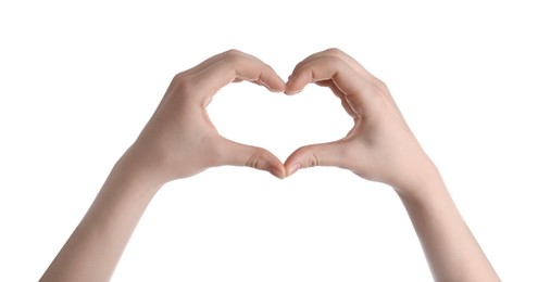 Photo of Woman making heart with her hands against white background, closeup