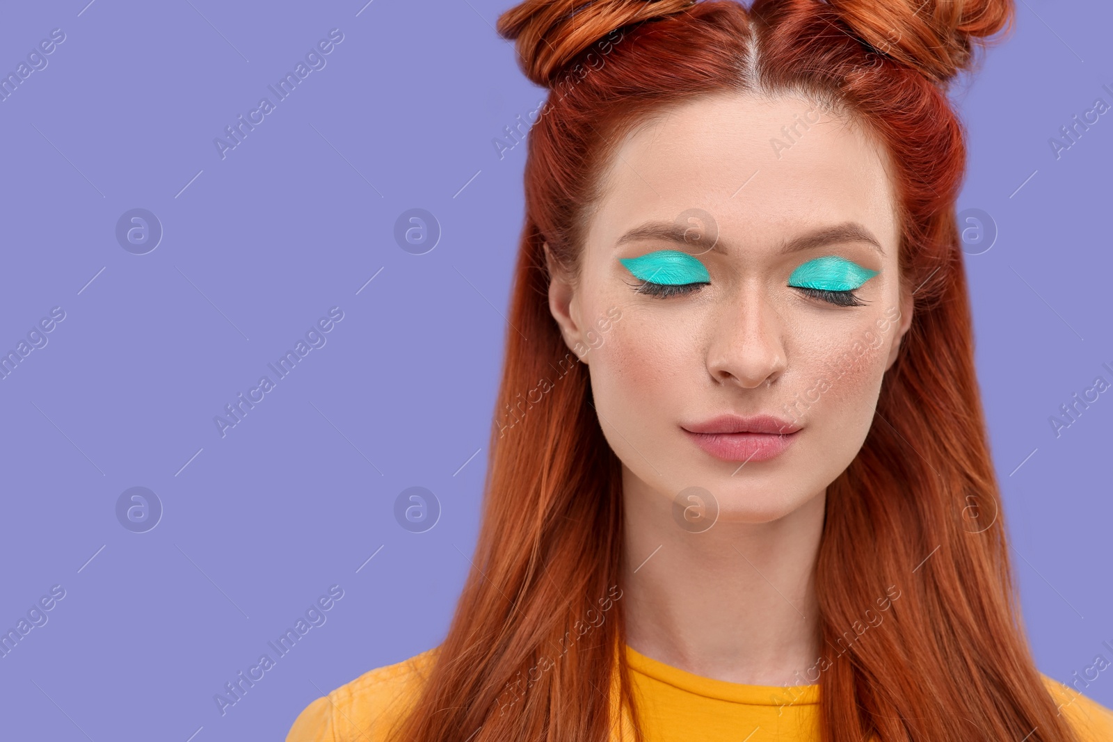 Photo of Beautiful woman with bright makeup and closed eyes on violet background. Space for text