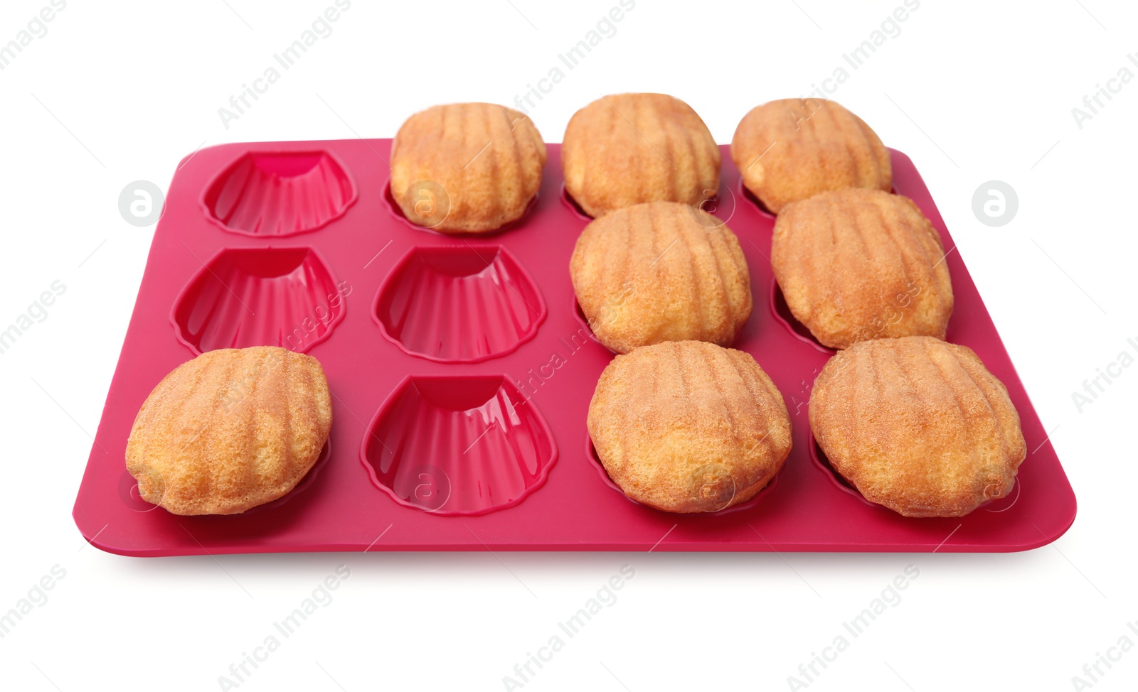 Photo of Many tasty madeleine cookies in baking mold isolated on white