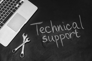 Photo of Flat lay composition with words "TECHNICAL SUPPORT" on dark background