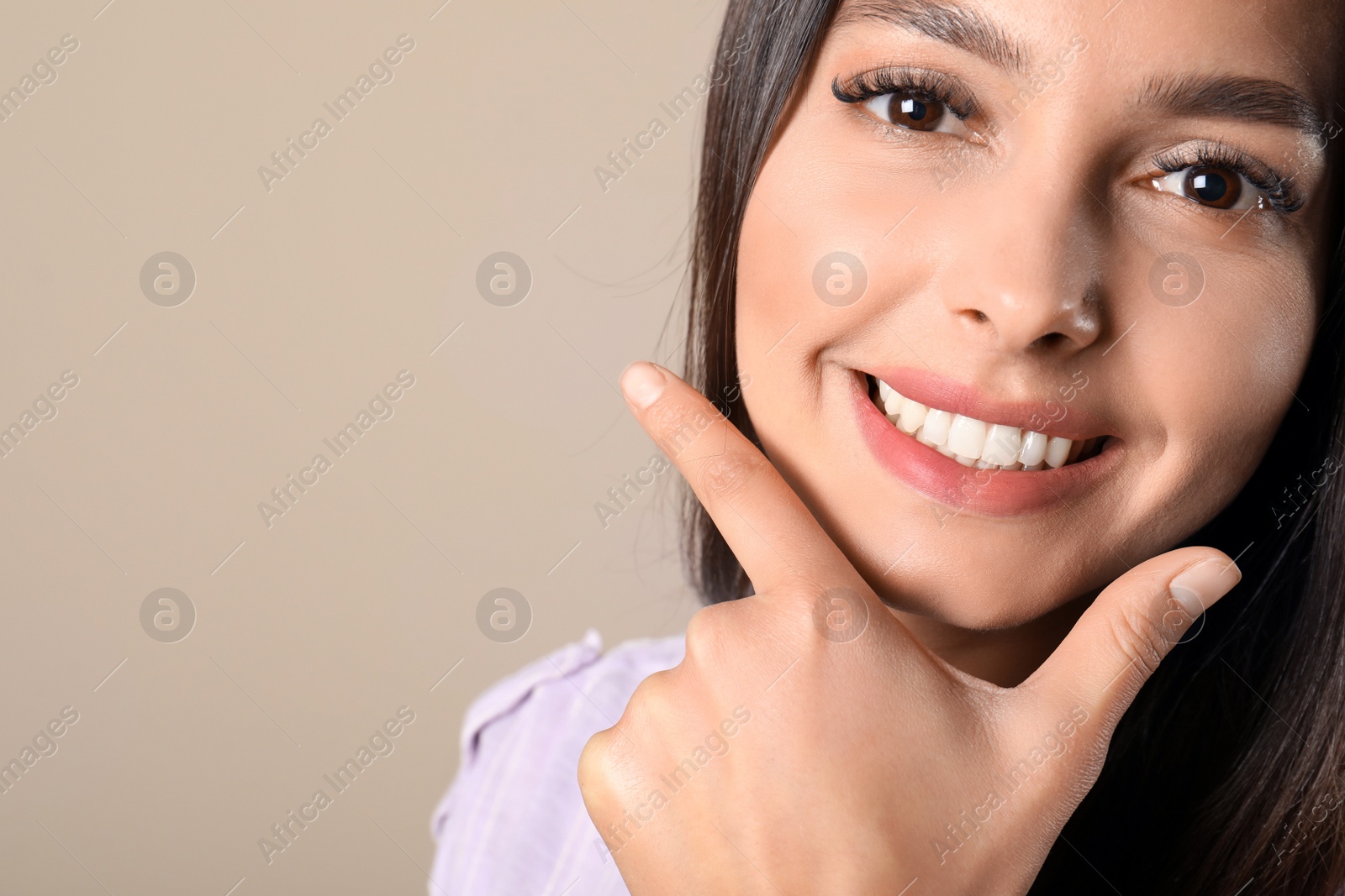 Photo of Young woman with healthy teeth on color background. Space for text