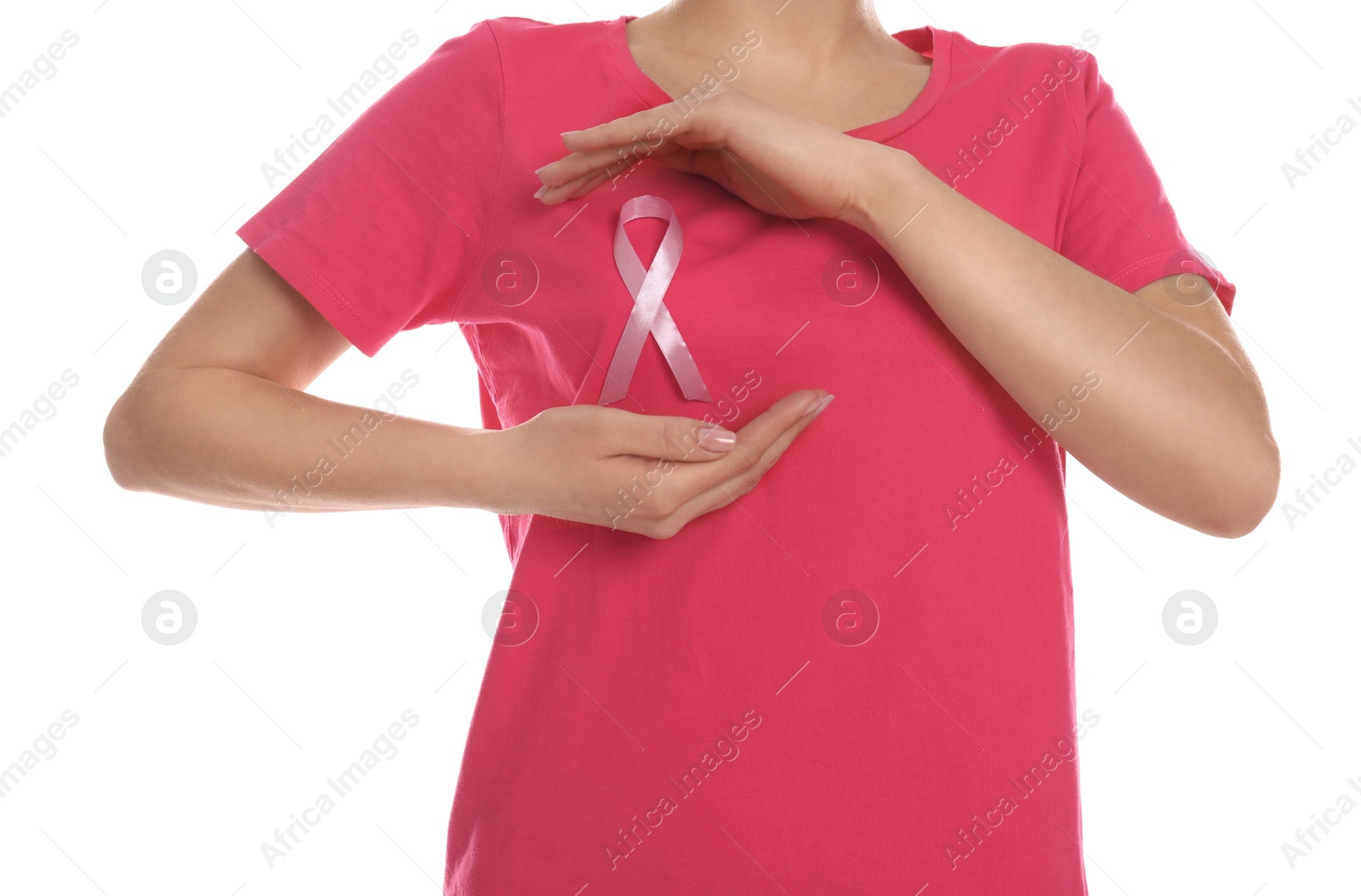 Photo of Woman with pink ribbon on white background, closeup. Breast cancer awareness