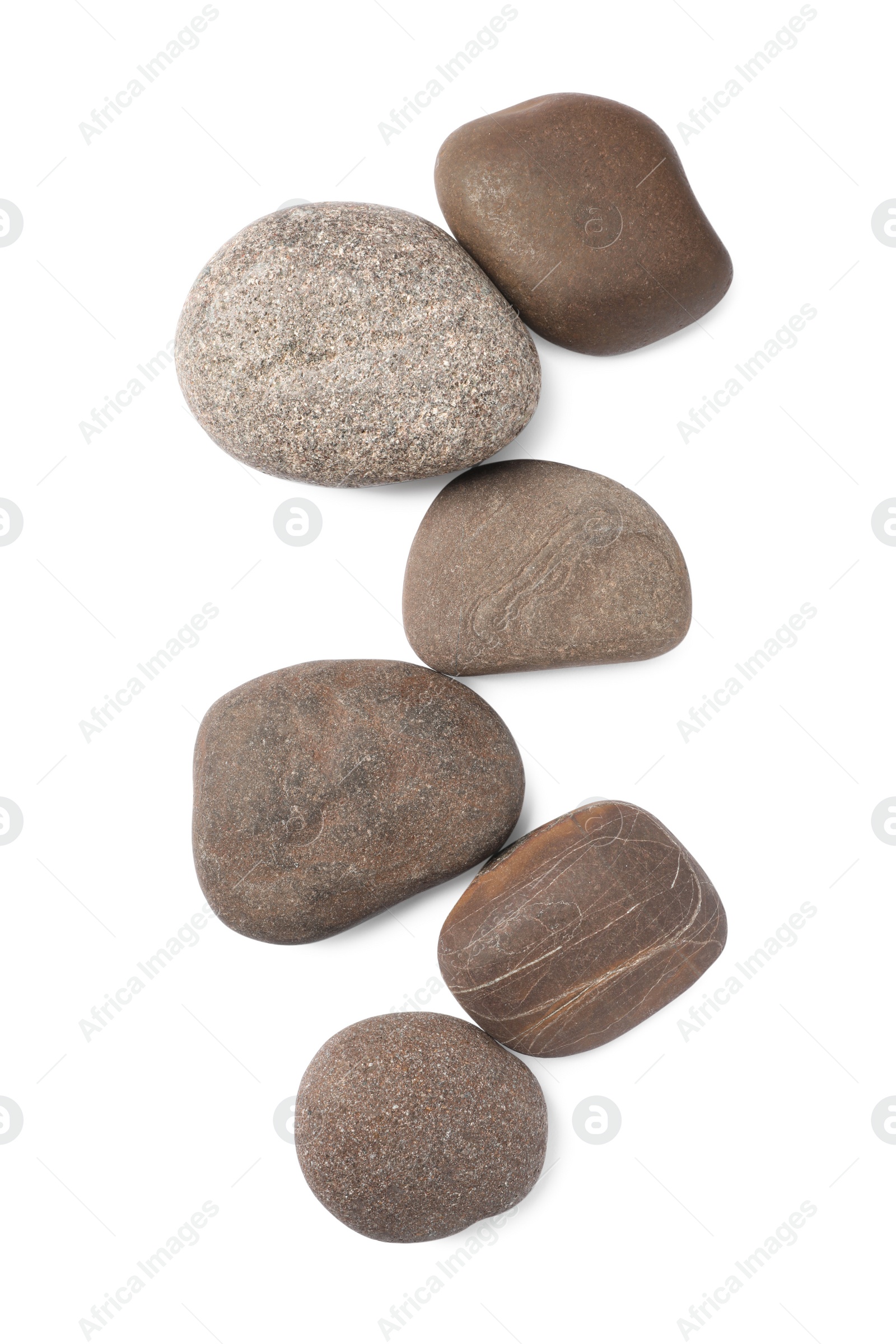 Photo of Group of different stones on white background, top view