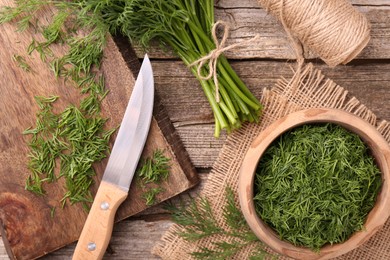 Flat lay composition with fresh dill on wooden table