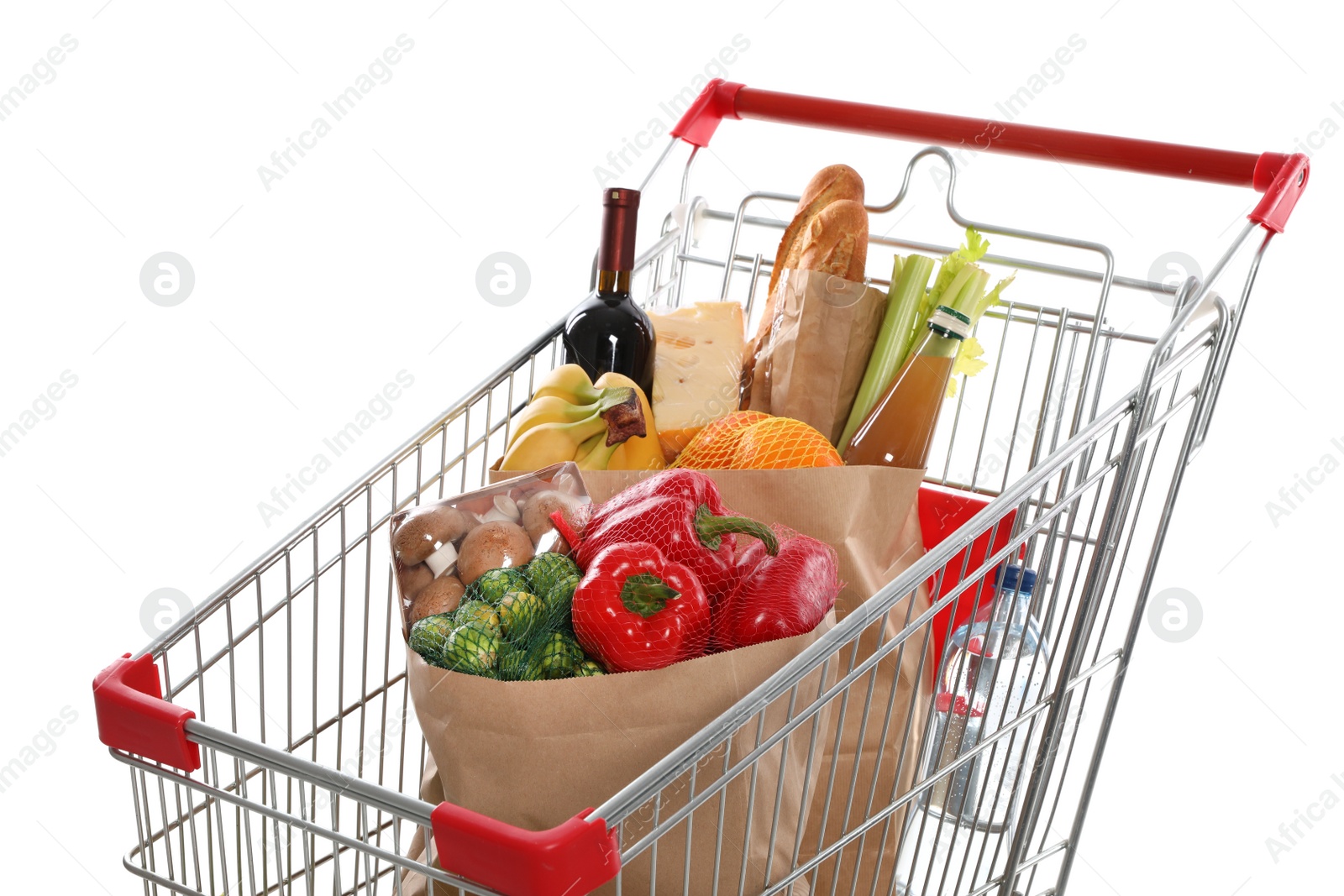 Photo of Shopping cart full of groceries on white background