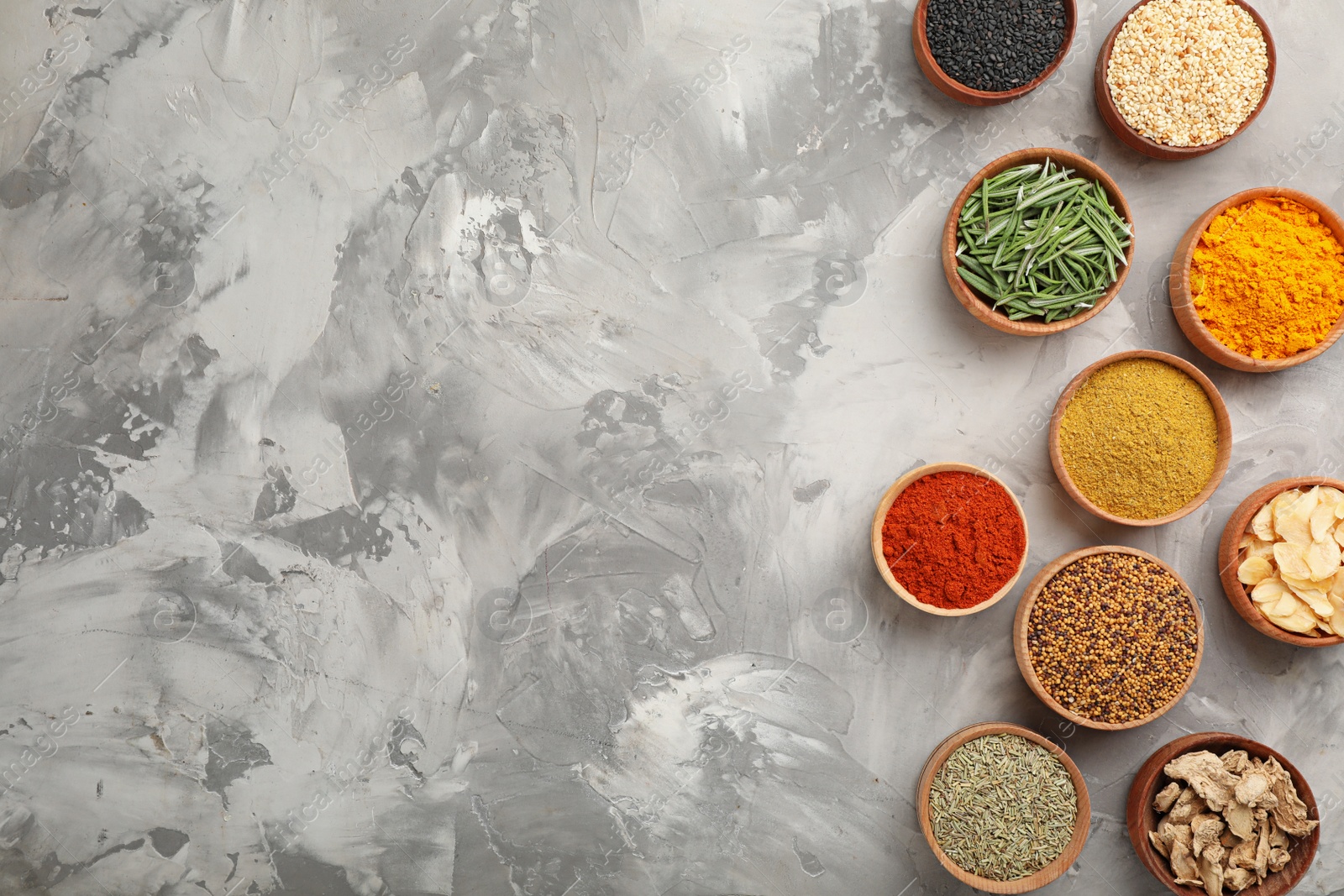 Photo of Flat lay composition with different aromatic spices on grunge background