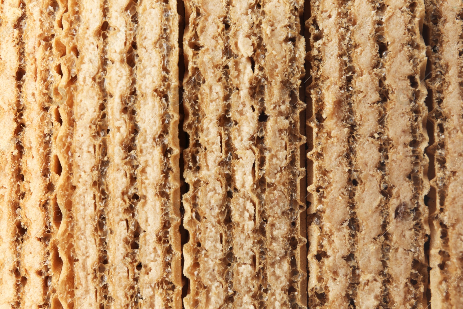 Photo of Closeup view of tasty wafer sticks as background. Sweet food