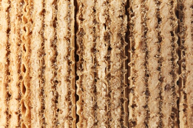 Photo of Closeup view of tasty wafer sticks as background. Sweet food