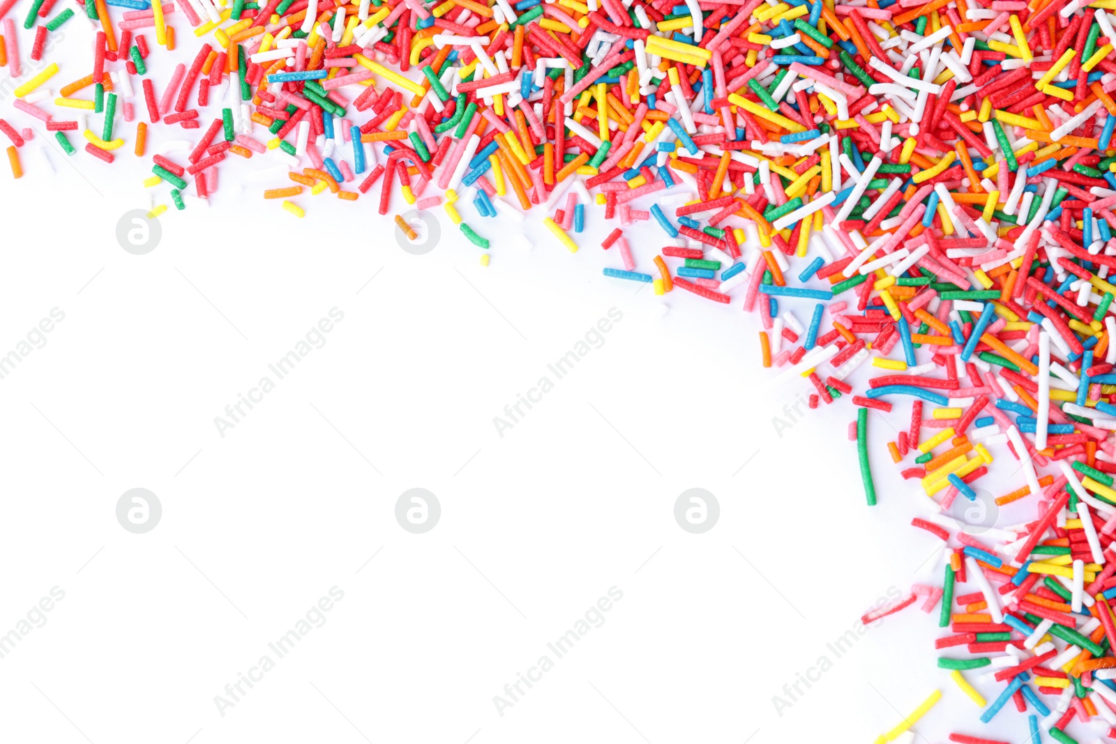 Photo of Colorful sprinkles on white background, top view. Confectionery decor