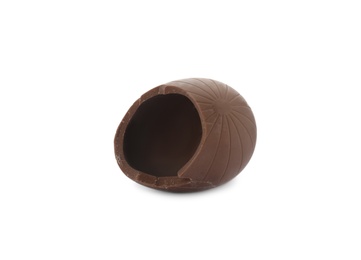 Photo of Broken milk chocolate egg on white background