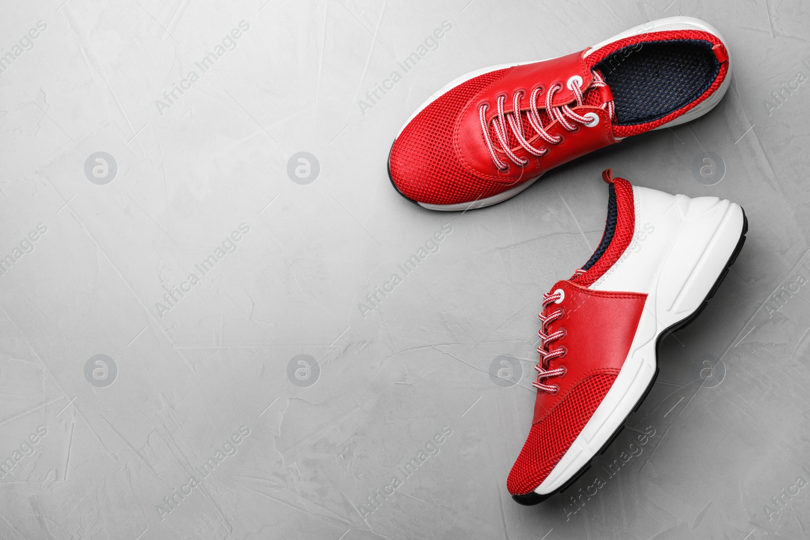 Photo of Pair of stylish shoes on grey background, top view. Space for text