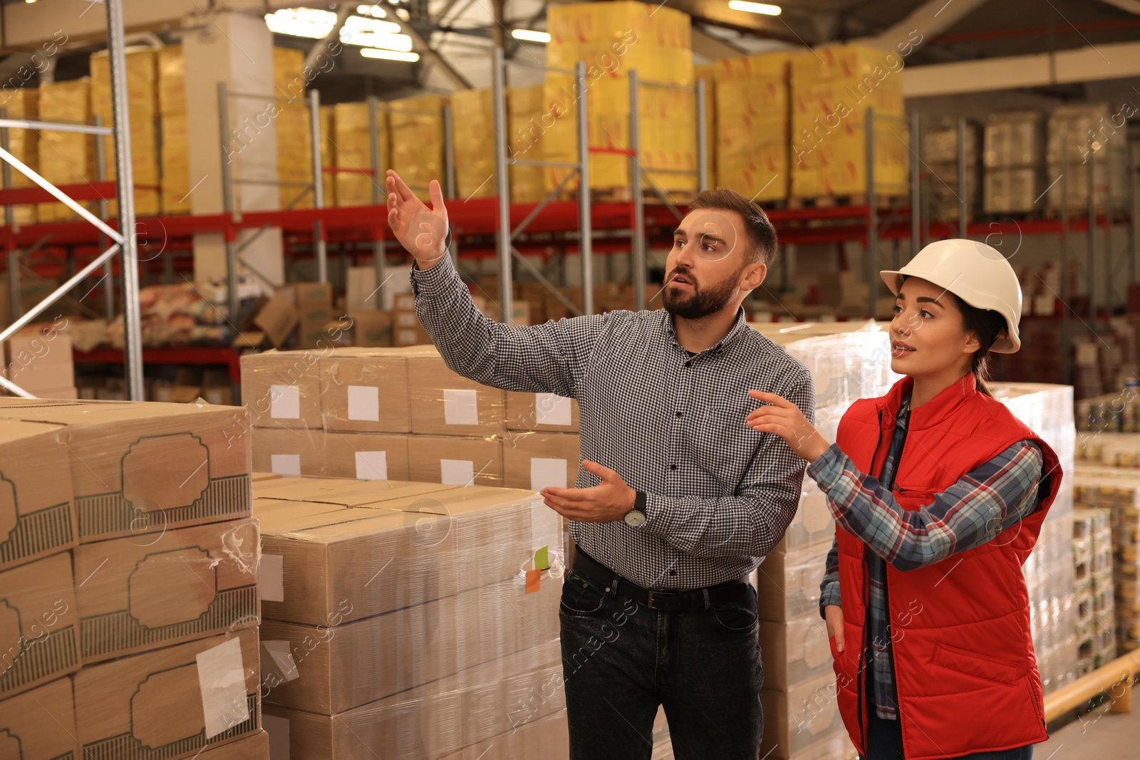 Image of Manager and supervisor at warehouse. Logistics center