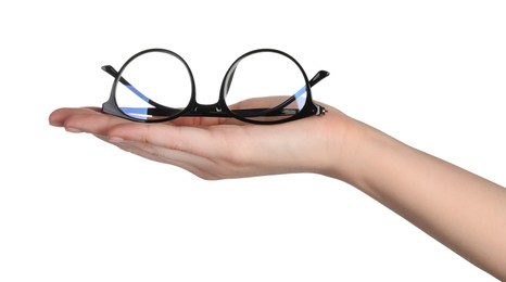 Photo of Woman holding glasses with black frame on white background, closeup