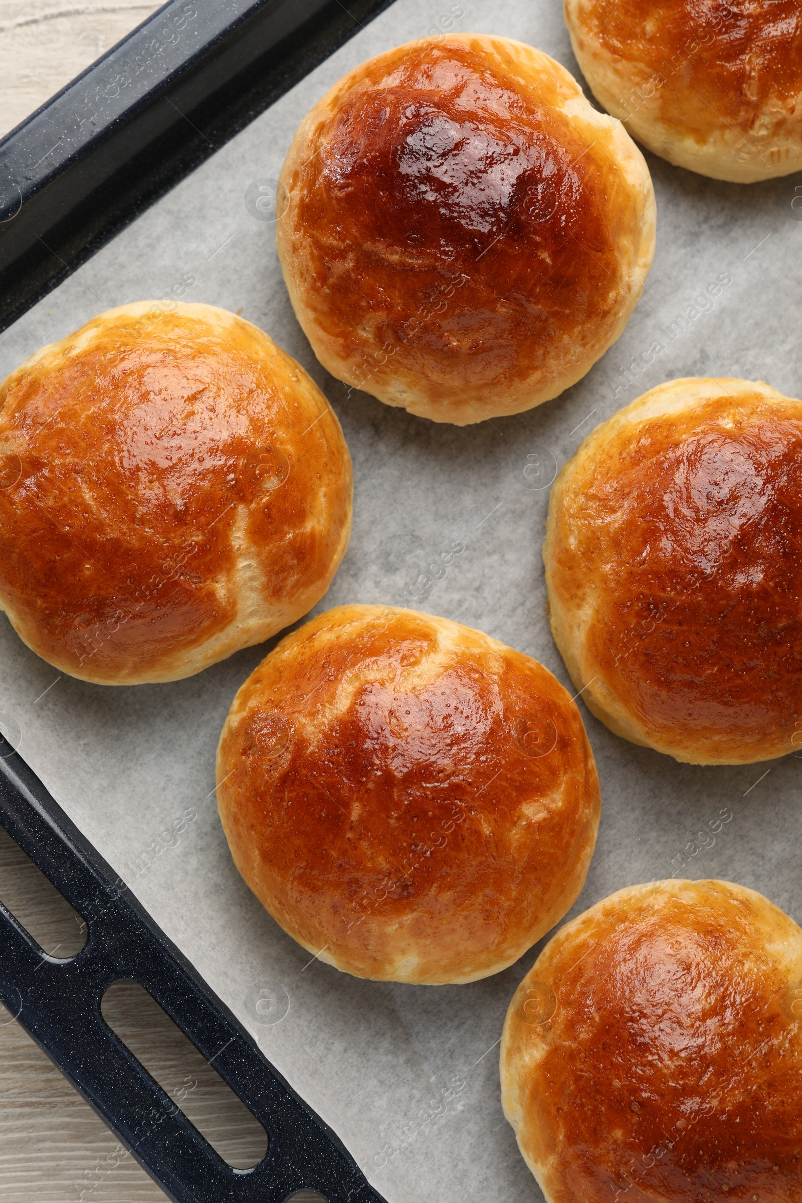 Photo of Baking sheet of freshly baked soda water scones on white wooden table, top view