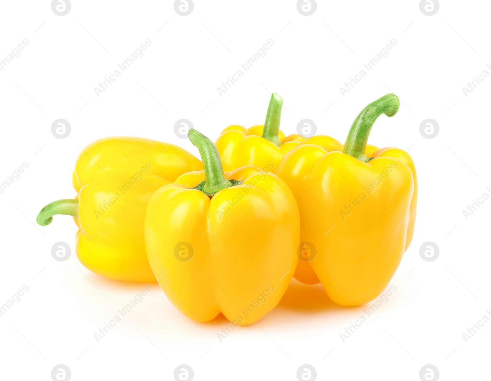 Photo of Ripe yellow bell peppers isolated on white