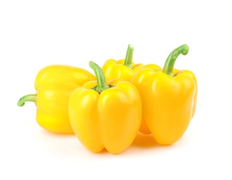 Photo of Ripe yellow bell peppers isolated on white