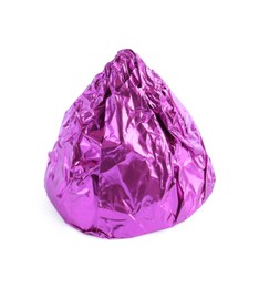 Photo of Tasty candy in violet wrapper isolated on white