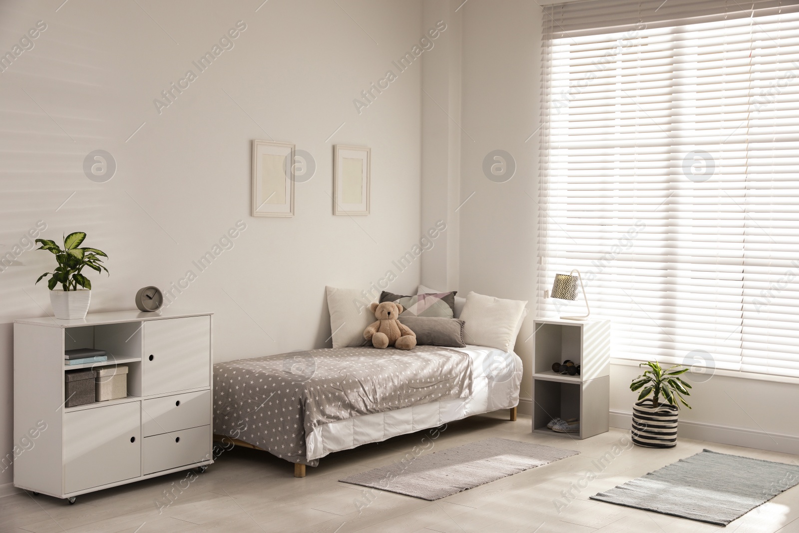 Photo of Modern child room interior with comfortable bed