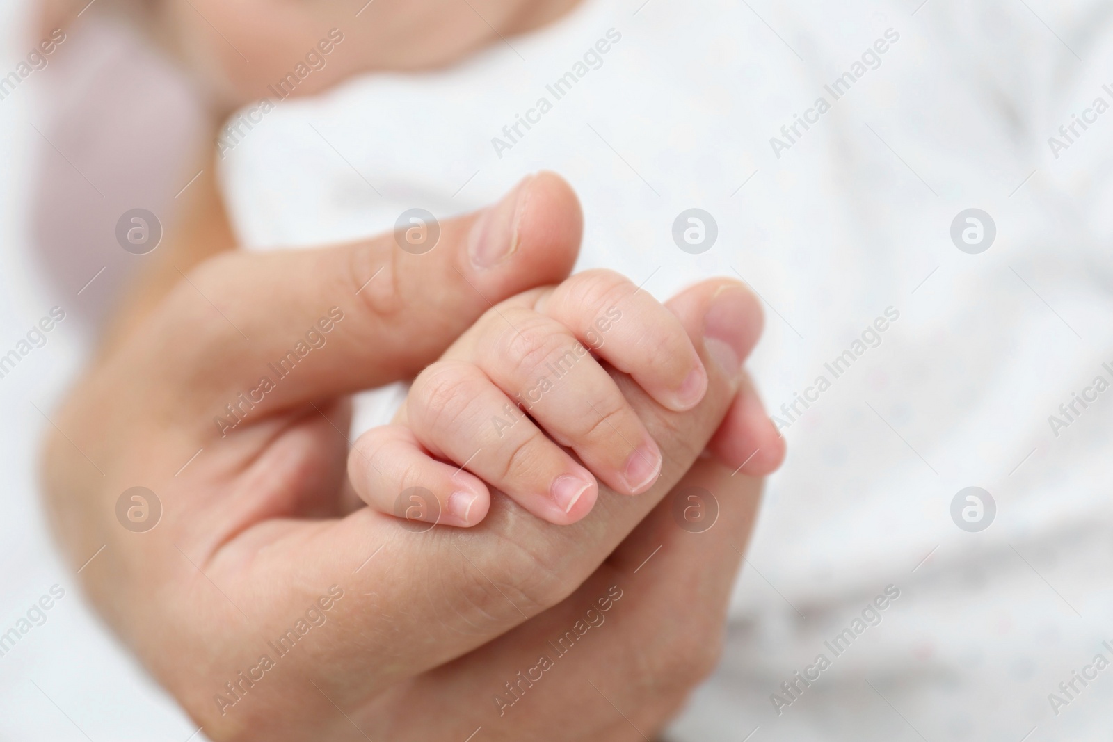 Photo of Father holding his cute baby, closeup view