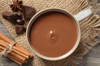 Flat lay composition with yummy hot chocolate on wooden table