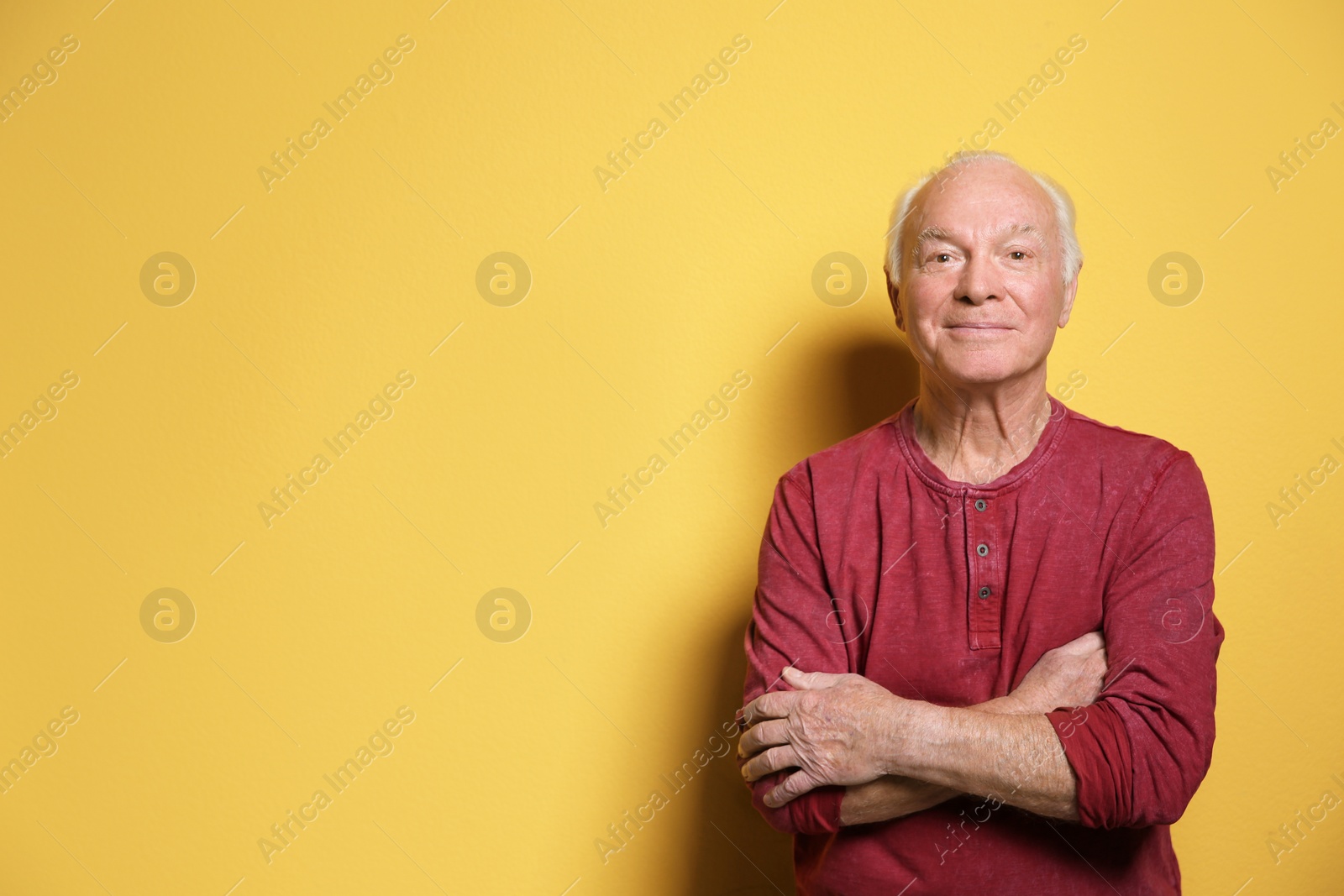 Photo of Portrait of elderly man on color background. Space for text