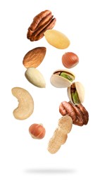 Image of Many different nuts in air on white background