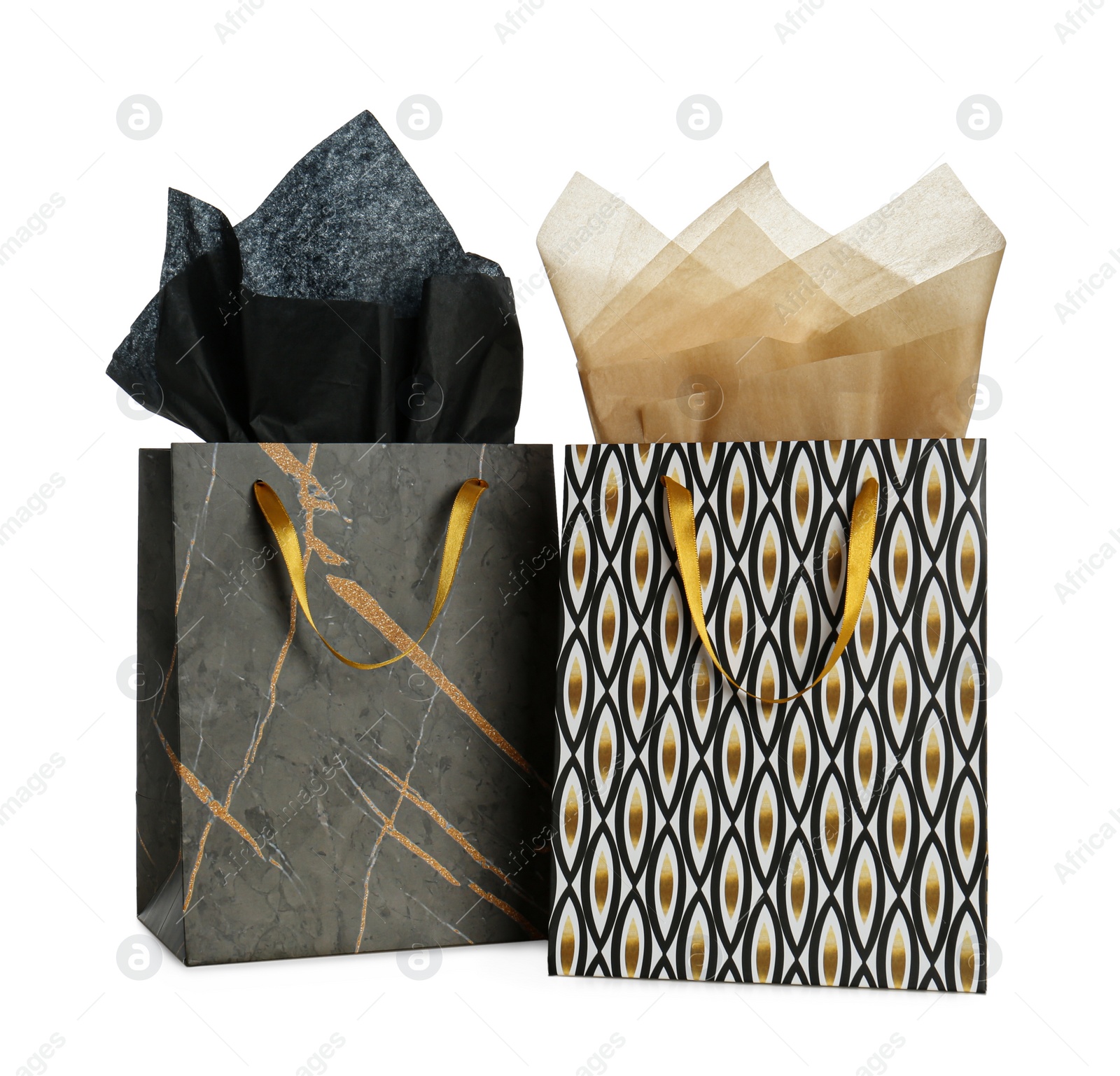 Photo of Gift bags with paper on white background