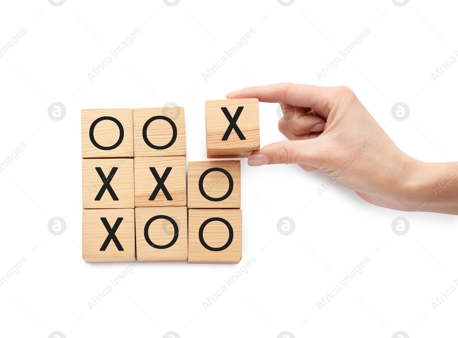 Photo of Woman playing tic tac toe game on white background, top view