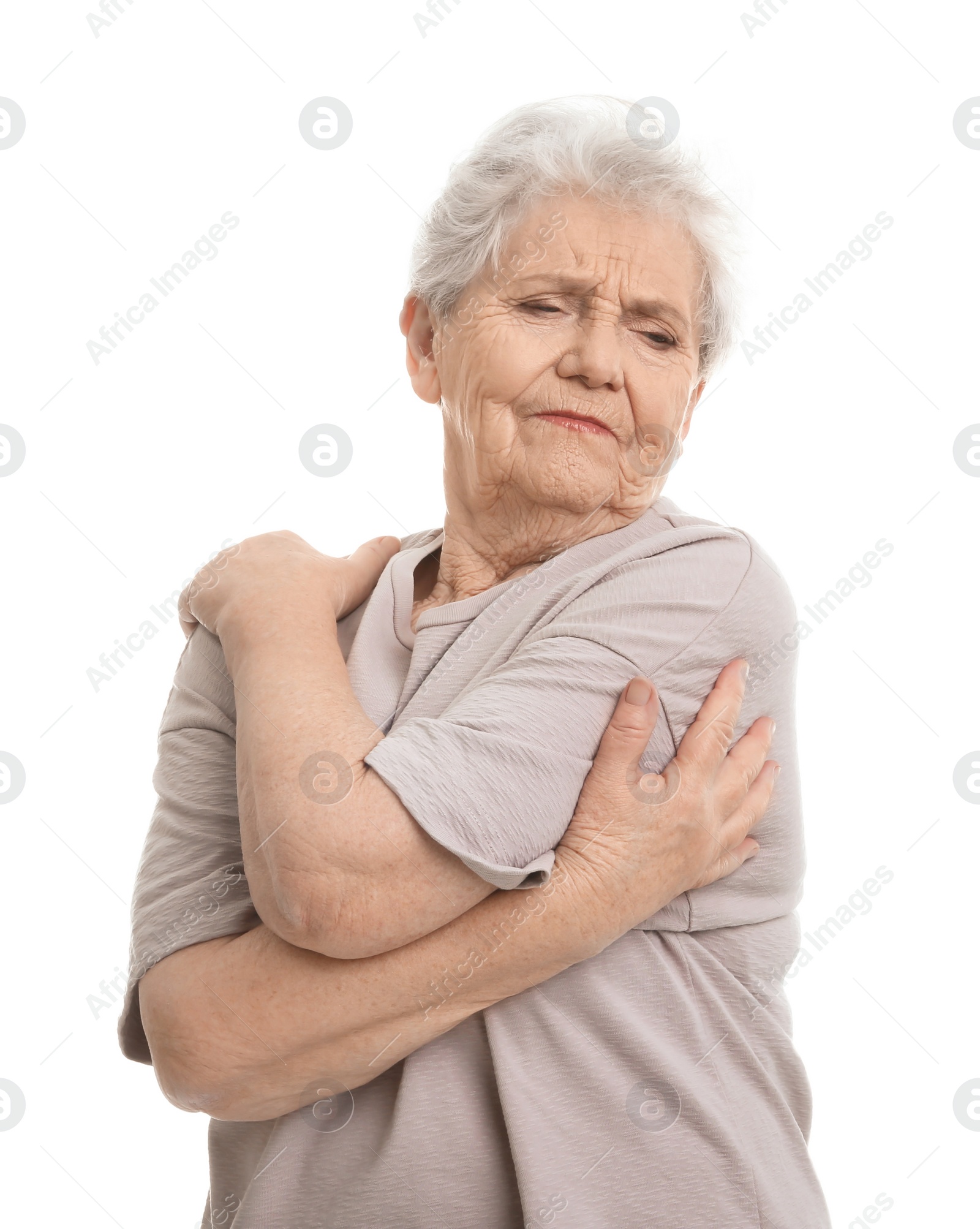 Photo of Elderly woman suffering from pain in shoulder on white background