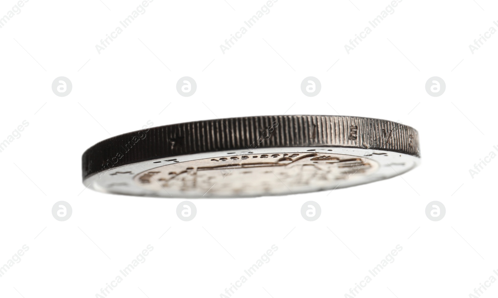 Photo of Metal coin on white background, view of edge