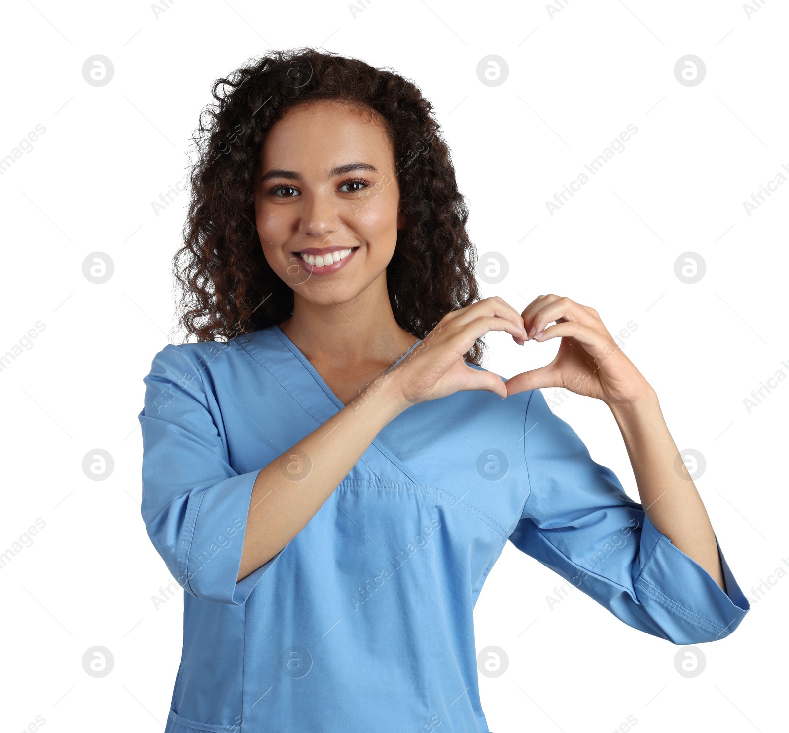 Photo of Happy young African-American doctor making heart with hands on white background