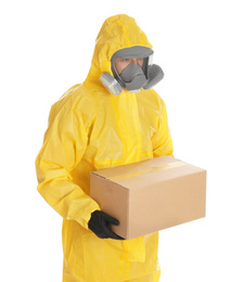 Photo of Man wearing chemical protective suit with cardboard box on white background. Prevention of virus spread