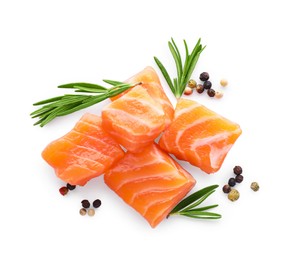 Pieces of fresh raw salmon and spices on white background, top view