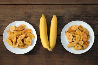 Photo of Tasty deep fried banana slices and fresh fruits on wooden table, flat lay