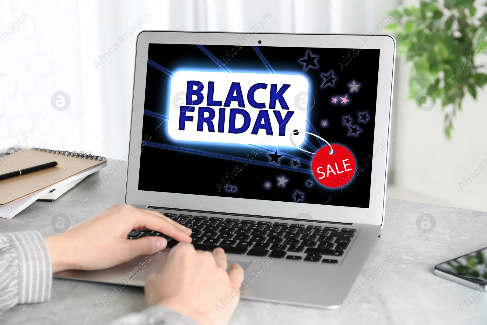 Image of Black Friday. Woman shopping online using laptop at table, closeup