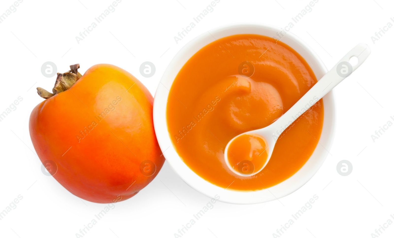 Photo of Delicious persimmon jam and fresh fruit isolated on white, top view