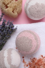 Flat lay composition with bath bombs on pink background